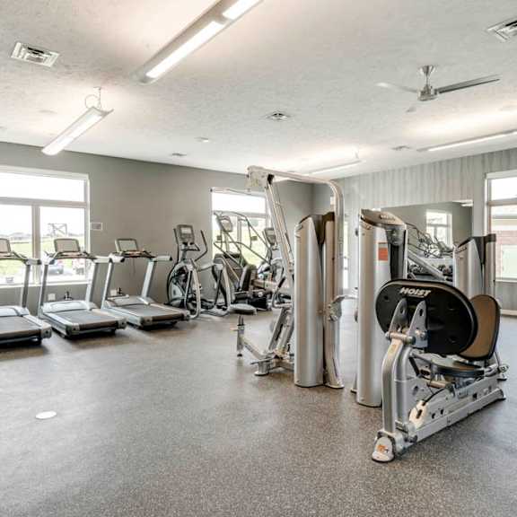 nice fitness center with treadmills and weightlifting machines at the villas at falling waters in west omaha ne