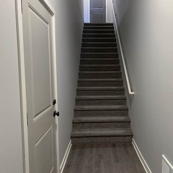 stairs leading to second story villa at the villas at mahoney park