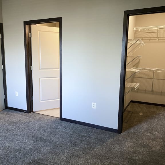 Thumbnail 7 of 16 master bedroom with access to walk in closet and private bathroom