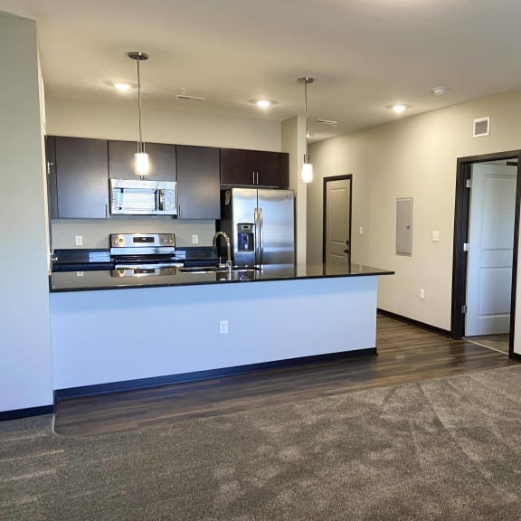 Thumbnail 6 of 16 View of the kitchen from the living room at the villas at mahoney park