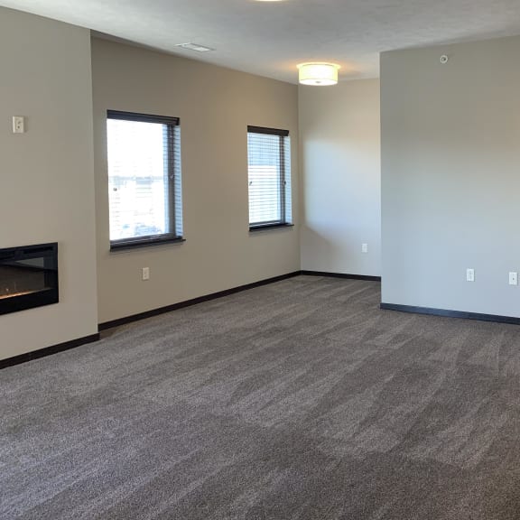 Thumbnail 13 of 26 carpeted living room and nook area
