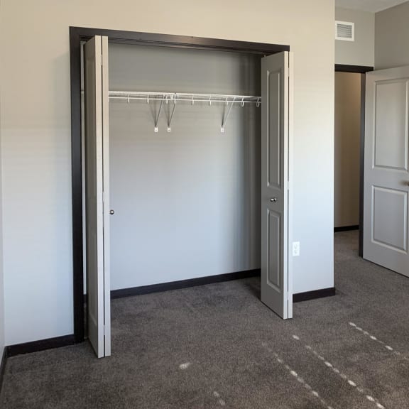 Thumbnail 22 of 26 carpeted bedroom with large closet and shelving space