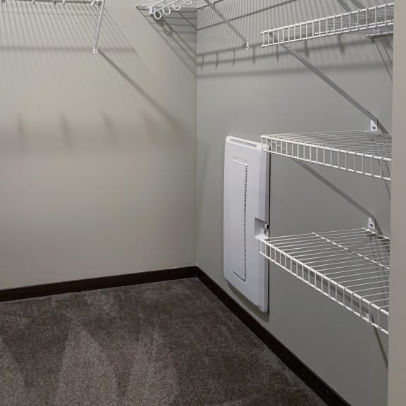 Thumbnail 16 of 26 Walk-in closet with shelving and rods of the master bedroom in the Grand Canyon floorplan