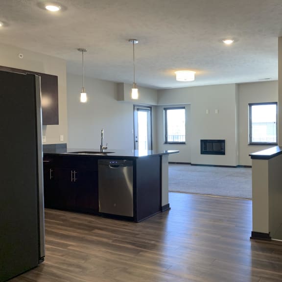 Thumbnail 10 of 26 View of the living area from behind the kitchen at the villas at mahoney park