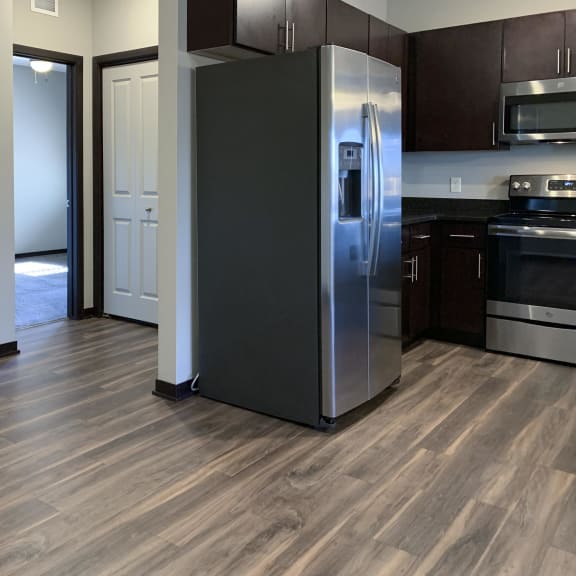 Thumbnail 7 of 26 Stainless steel fridge with hallway to master bedroom