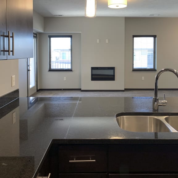 Thumbnail 6 of 26 large granite counter with double sided sink in the kitchen of the grand canyon floorplan