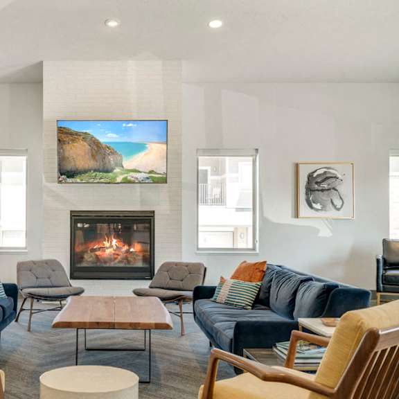 couches near the fireplace in the clubhouse at the villas at mahoney park