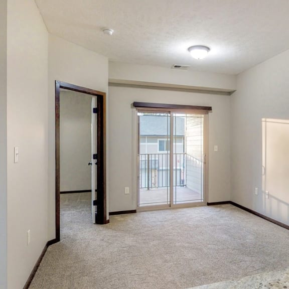 Thumbnail 11 of 19 Natural light fills the living and dining space in the Ash at The Villas at Wilderness Ridge in southwest Lincoln NE 68512
