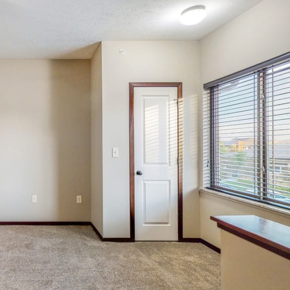 Thumbnail 12 of 19 Natural light fills the living and dining space in the Ash at The Villas at Wilderness Ridge in southwest Lincoln NE 68512