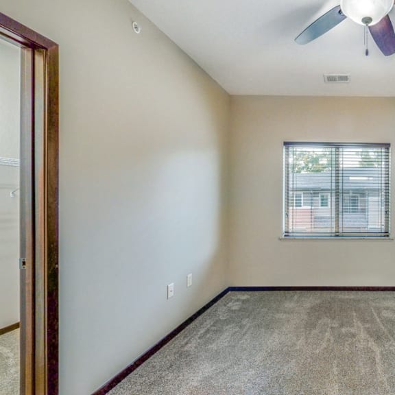 Thumbnail 14 of 19 Large bedrooms are filled with natural light in the Ash at at The Villas at Wilderness Ridge luxury apartments in southwest Lincoln NE 68512