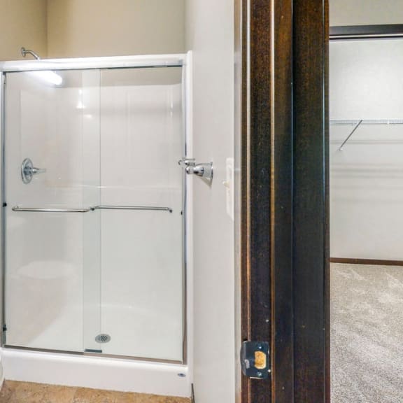 Thumbnail 18 of 19 The master bath in the Ash features a shower with glass doors.