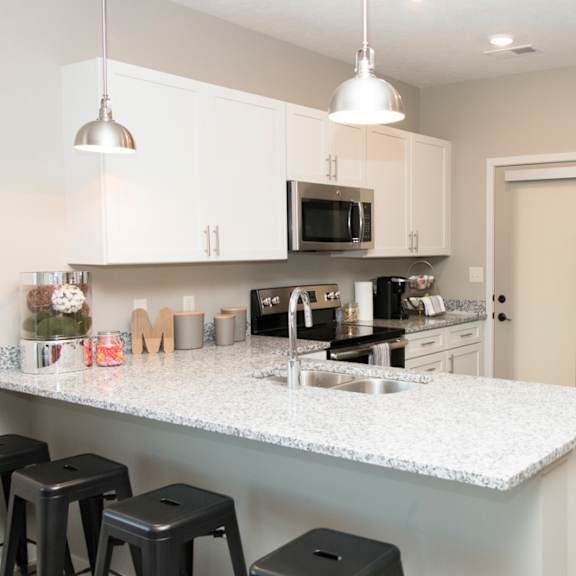 Thumbnail 3 of 13 white cabinet kitchen with bar stool seating