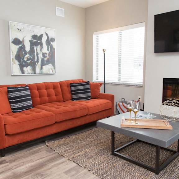 living room space with fireplace at the villas at mahoney park