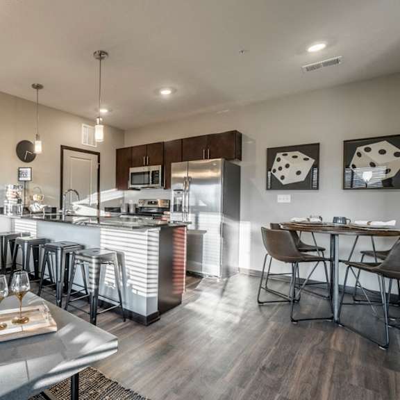 Thumbnail 7 of 16 Open floor plan living room and kitchen at The Villas at Mahoney Park