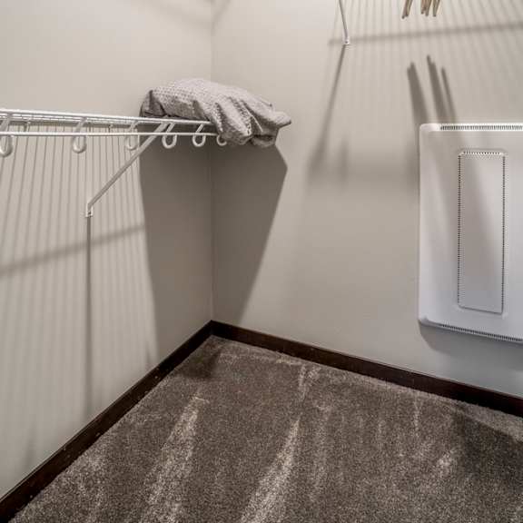 Thumbnail 15 of 16 Walk in closet with shelves providing extra storage at The Villas at Mahoney Park