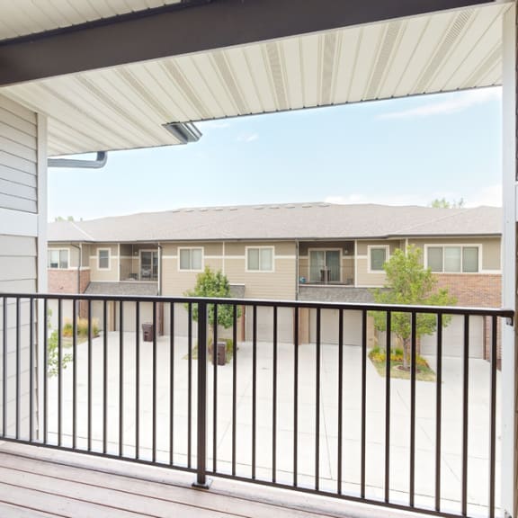 Thumbnail 12 of 17 spacious balcony with rail and view of villas