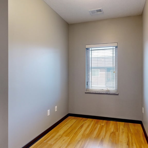 Thumbnail 8 of 17 a unique nook with hardwood floors and a small window