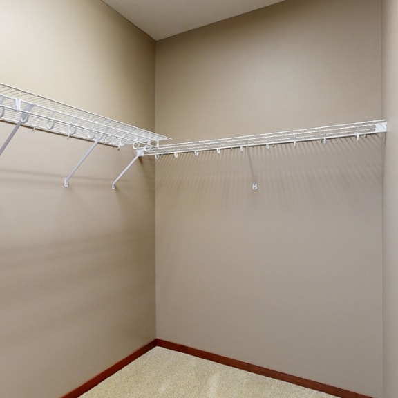 Thumbnail 17 of 20 a large walk in closet with wire shelving