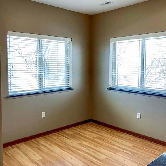 Thumbnail 6 of 19 A dining area with windows.