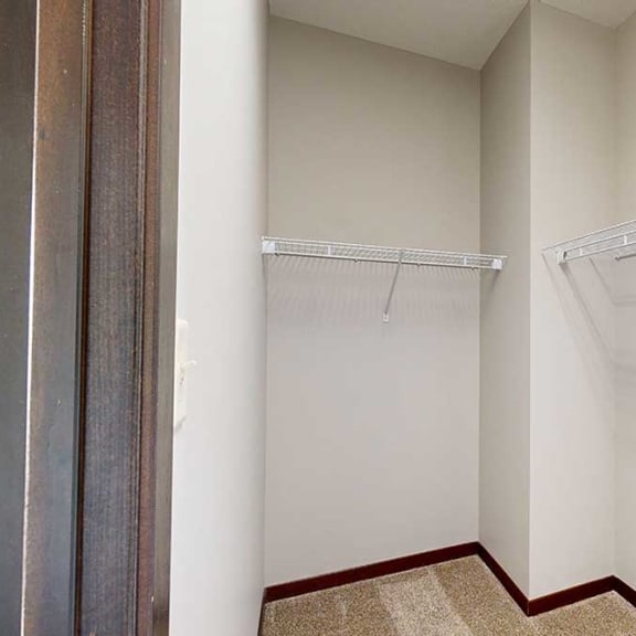 Thumbnail 19 of 22 a walk-in closet with built-in shelves and hanging space