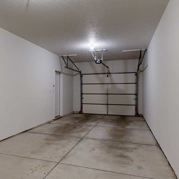 Thumbnail 22 of 22 a two-car tandem garage with an extra nook for storage