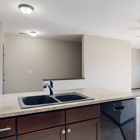 Thumbnail 8 of 22 a swanstone double sink in a granite kitchen peninsula countertop