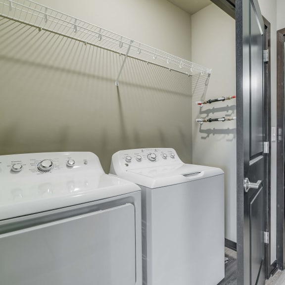 Thumbnail 16 of 17 Laundry area and spacious bathroom at WH Flats new luxury apartments in south Lincoln NE 68516