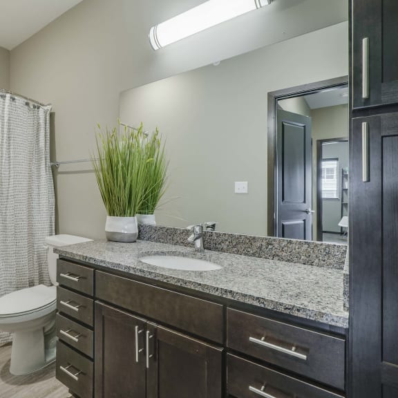 Thumbnail 17 of 17 Bathroom with granite countertops at WH Flats new luxury apartments in south Lincoln NE 68516