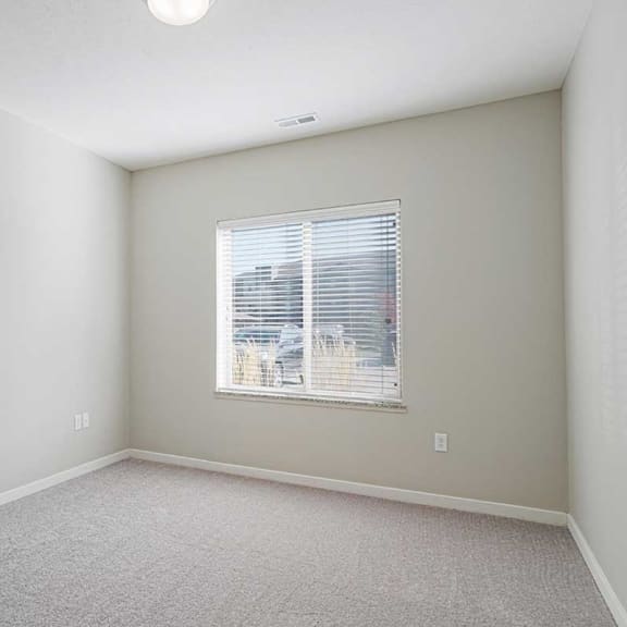 Thumbnail 14 of 19 a bedroom with a large window