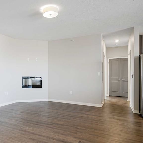 Thumbnail 9 of 27 a living room with luxury vinyl wood floors and a fireplace