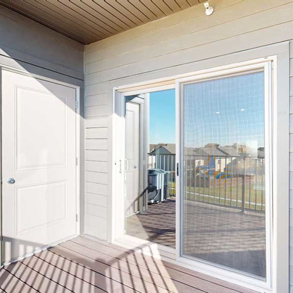 Thumbnail 13 of 29 a balcony with outdoor storage and a sliding glass door