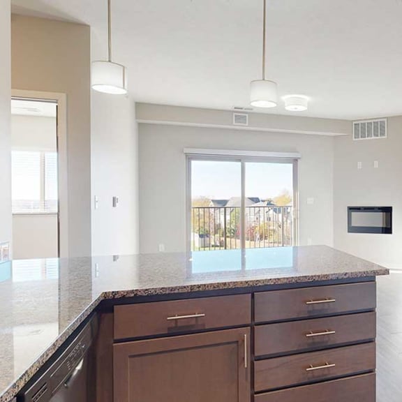 Thumbnail 9 of 29 an open-concept living room and kitchen with peninsula countertop
