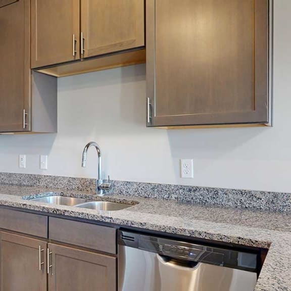 Thumbnail 7 of 29 kitchen counters and cabinets, showcasing ample storage and stainless steel sink with a modern faucet