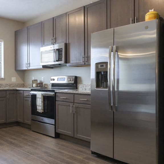 Thumbnail 6 of 8 Open kitchen with gray cabinetry