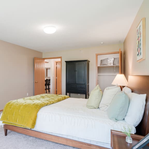 Thumbnail 14 of 20 Furnished bedroom with a bed and a yellow blanket