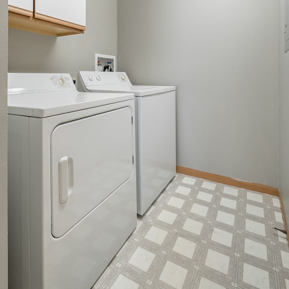 Thumbnail 4 of 10 full-sized washer and dryer in laundry room at Williamsburg Park Apartments in Lincoln NE