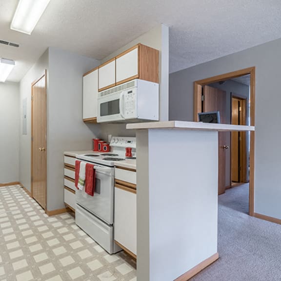 Thumbnail 3 of 10 bright kitchen with lots of storage at Williamsburg Park Apartments in Lincoln NE