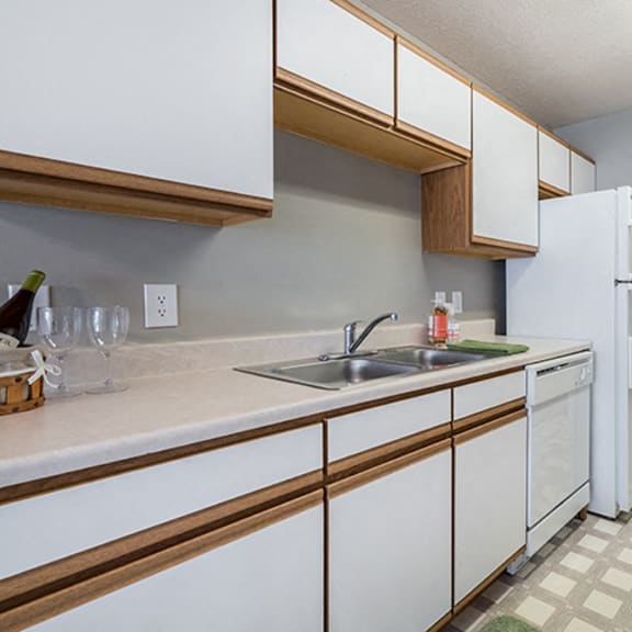 Thumbnail 2 of 10 kitchen with laundry room off to side at Williamsburg Park Apartments in Lincoln NE