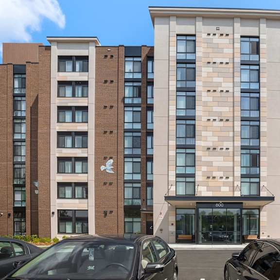 a view of the front of the building with cars parked in front of it