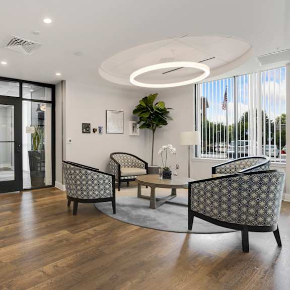 a  lobby area filled with furniture and a large window