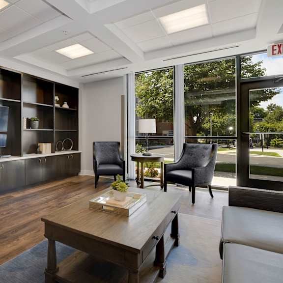 a living room filled with furniture and a large window