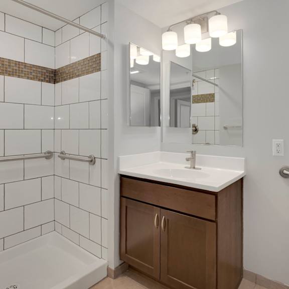 a bathroom with a sink toilet and shower