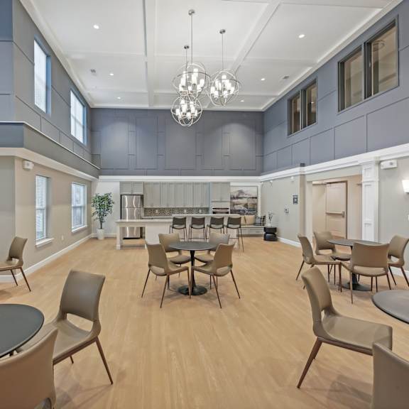 a large room with tables and chairs.