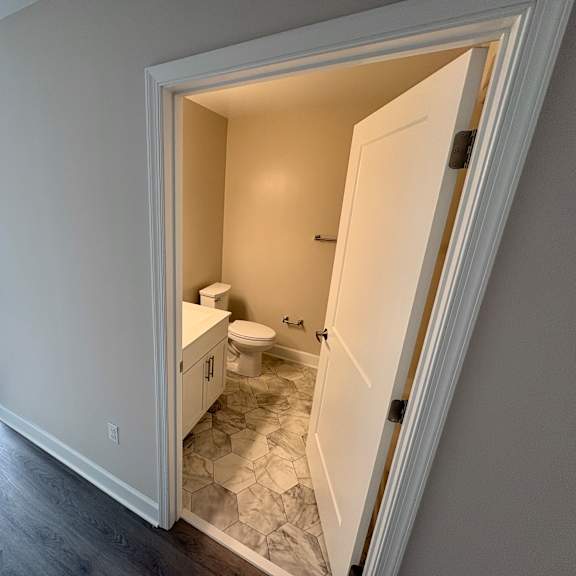 a bathroom with a toilet and sink is shown.