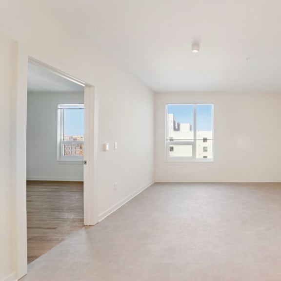 empty room with a window and a door.