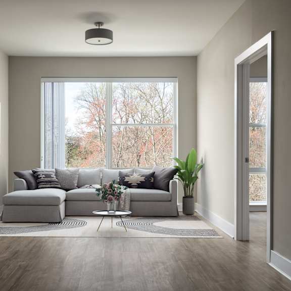 a living room with a couch in front of a window