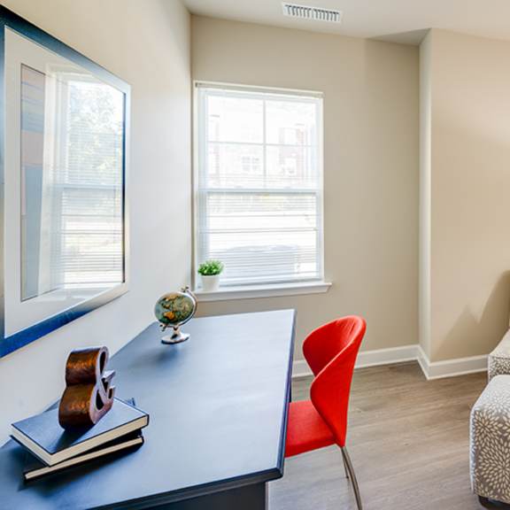 bedroom with lounge chair and desk