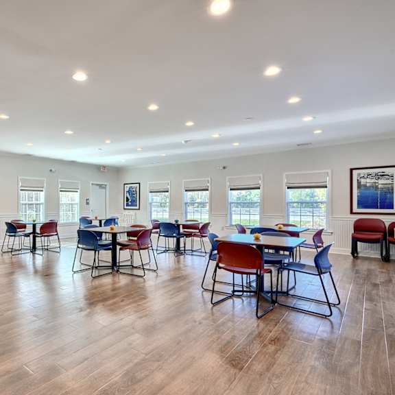 the dining room at our community center with tables and chairs