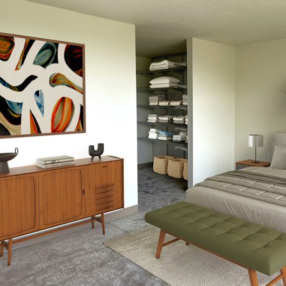 a bedroom with a large bed and a wooden cabinet.