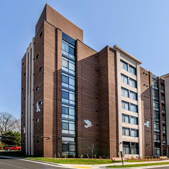 a view of the back of the building with a clear blue sky in the background